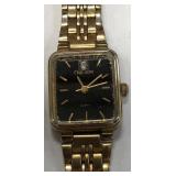 11 - OLEG CASSINI GOLD TONE LADIES WRISTWATCH (153