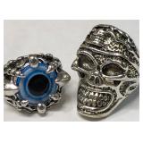 11 - TWO SILVER TONE SKULL & CLAW EYE RINGS (129)