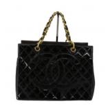 CHANEL Black Handbag with Gold Chain Accents
