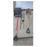 Two shovels a plant holder and a Reese extender