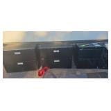 Three metal filing cabinets