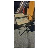 Two folding tables in a stand