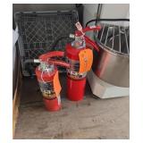 Two fire extinguishers still charged