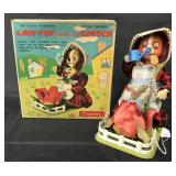 Boxed Battery Op Lady Pup Tending Her Garden