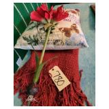 Red crochet throw, floral pillow