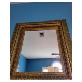 Decorative gold colored mirror