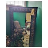 Tall beveled mirror, bronze design stand