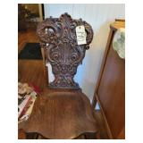 Antiqued carved wood hall chair