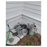 2 watering cans, bucket, butterfly stepping stone
