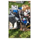 Pallet of oil, filter wrenches, belt, and mudflaps