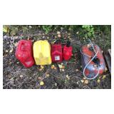 4 plastic fuel cans and boat fuel can