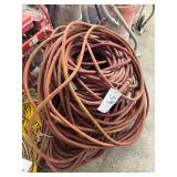 Bundle of Red Industrial Water Hoses
