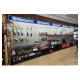 Husqvarna Wall-Mount Retail Display Shelving: 6 Sections, Gray Pegboard, Blue Branded Headers, Peg Hooks, and Shelves