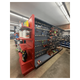 Freestanding Gondola Display Shelving: 3 Double-Sided Sections, Gray Pegboard with Red End Cap, Peg Hooks, and Shelves