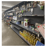 Freestanding Gondola Display Shelving: 7 Double-Sided Sections, Tan Pegboard with Red End Cap, Peg Hooks, Wire Baskets and Shelves