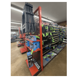 Freestanding Gondola Display Shelving: 3 Double-Sided Sections, Black Pegboard, Red End Cap with Wire Grid Top