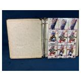 Binder of Olympic Trading Cards Featuring Athletes