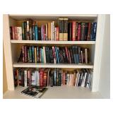 Hardcover and Paperback Books in Shelving Unit