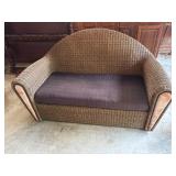 Wicker Sofa with Marble Accents and Cushion