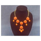 Gold-Tone Necklace with Orange Bead Accents and Da