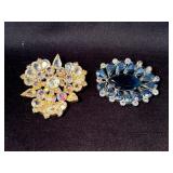 Gold and Silver-Tone Rhinestone Brooches Featuring