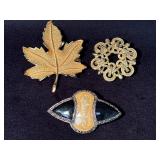 Three Decorative Metal Brooches Featuring Leaf and