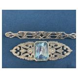 Two Silver-Tone Brooches, One with Light Blue Glas