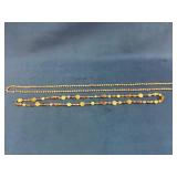 Two Beaded Necklaces Featuring Glass and Metal Ele