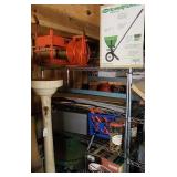 Shelf Unit With Tools and Household Items