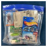 Bag of Die-Cast Sealed Carded Car Lot (12)