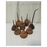 Eight Primitive Thumb Pump Oil Cans