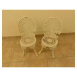Two metal patio chairs