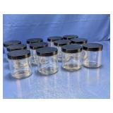 (12) Glass Storage Jars with Black Lids