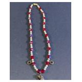 Red Beaded Necklace w/ Figure and Wreath Charms