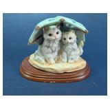Cat Figurine Under Umbrella Display