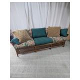 Rattan Sofa Couch with Floral Cushions