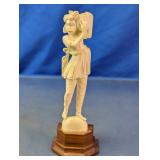 Carved Figurine on Wooden Base