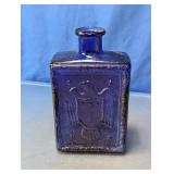 J.W. Dant Cobalt Blue Embossed Glass Bottle