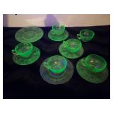 uranium glass mugs, saucers, and plate