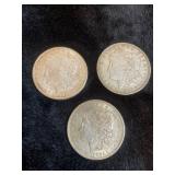 three 1921 D Morgan silver dollars