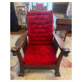 Oak Reclining Morris Chair with Carved Animal Heads and Red Tufted Cushions