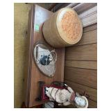Assorted Decorative Items Including Doll in Cart, Kinetic Sculpture, and Round Storage Container