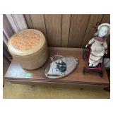 Assorted Decorative Items Including Doll in Cart, Kinetic Sculpture, and Round Storage Container