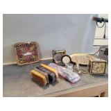 Household Items Including Clocks, Radio, Brushes, Trivet, and Plate