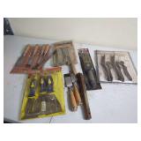 Hand Tool Collection Including Chisels, Putty Knives, and Detail Brushes