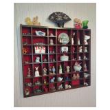 Wall-Mounted Wooden Display Shelf with Assorted Miniature Figurines