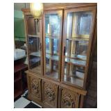 Three-Door Wooden Display Cabinet with Glass Shelving and Mirrored Backing
