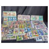 Assorted NFL Football Trading Cards in Protective Sleeves