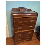 Four-Drawer Wood Dresser with Chevron Inlay and Decorative Metal Pulls