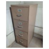 Four-Drawer Metal Filing Cabinet with Assorted Industrial Hardware and Electrical Components